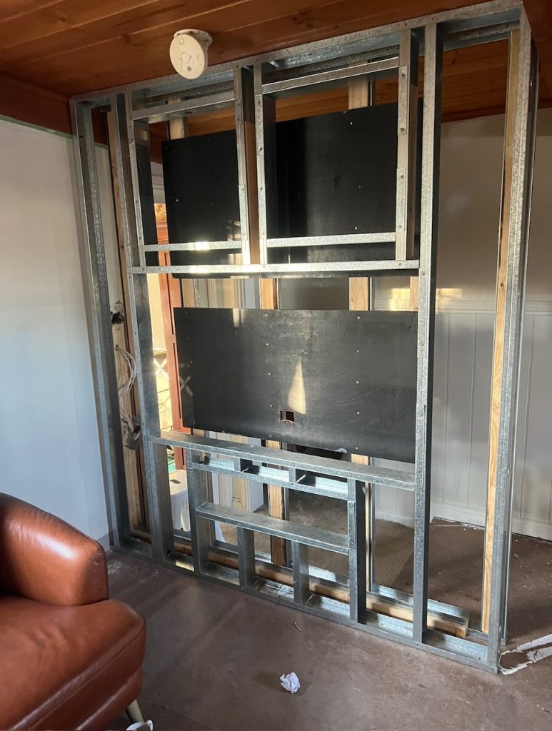 Steel stud framing built out on a living room feature wall